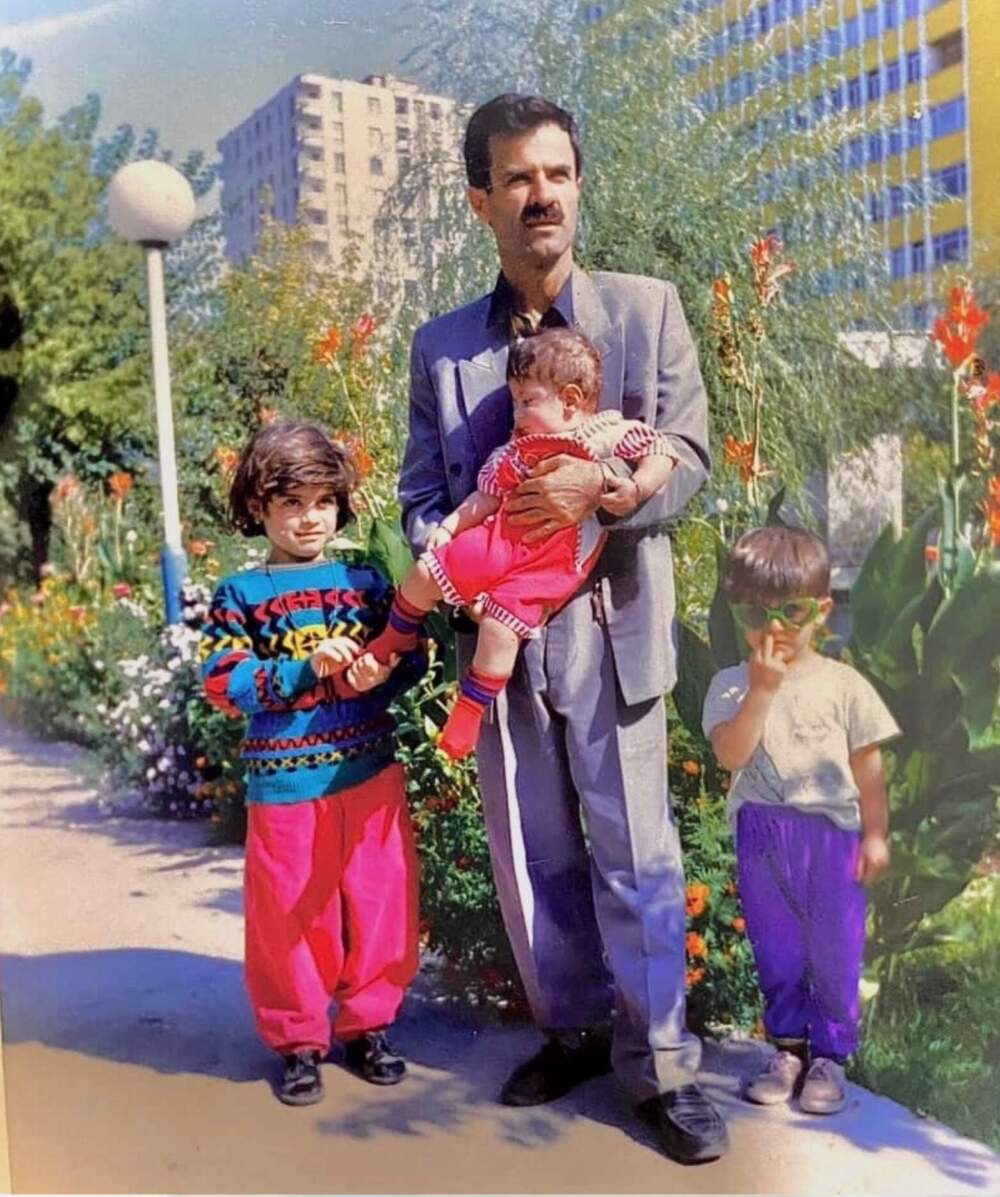 Karim Haddadi poses with his children in Ankara, Turkey before the family migrated to the United States. (Photo courtesy of the Haddadi family)